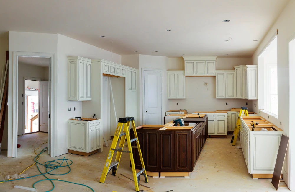 Ongoing kitchen remodels with cabinets and tools.